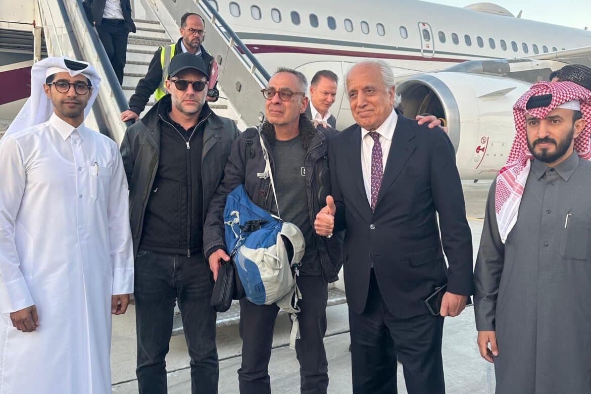 Photo: An image of a brochure published by the Qatar Ministry of Foreign Affairs shows the American citizen George Glezmann (c) posing for a photo in Kabul, March 20, 2025, before his departure to Doha. 