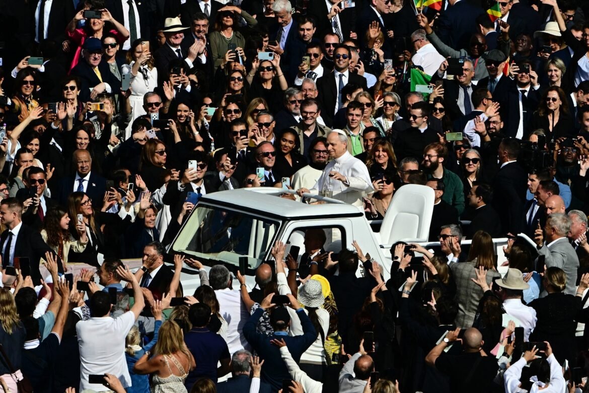 Pope Leo XIV travels St. Peter's Square in Popemobile before the inaugural Mass