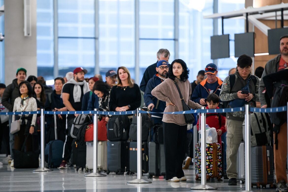 PHOTO: People wait in a security check line at George Bush Intercontinental Airport in Houston, Texas, on November 4, 2025. 